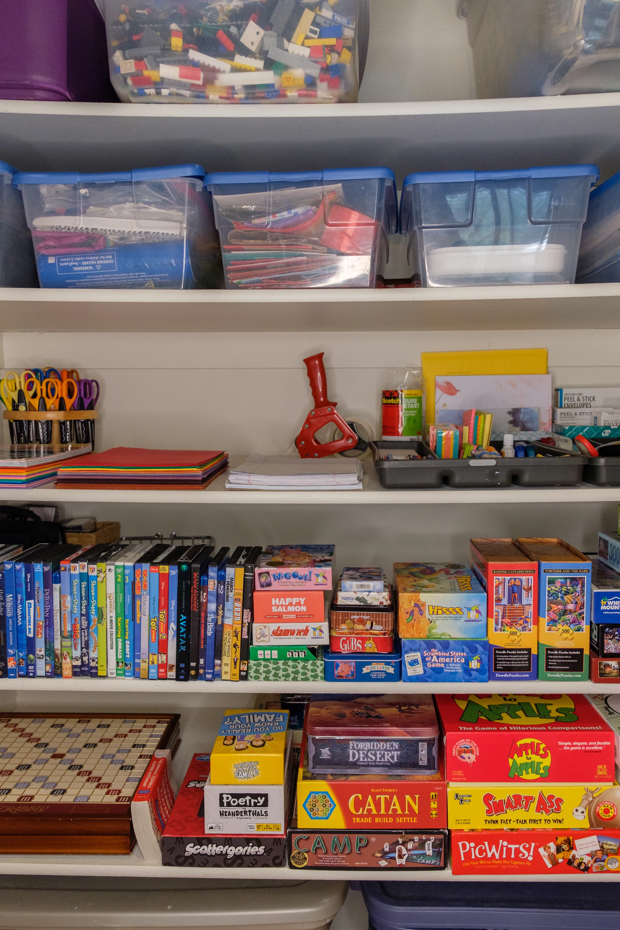 Organized closet with games and office supplies