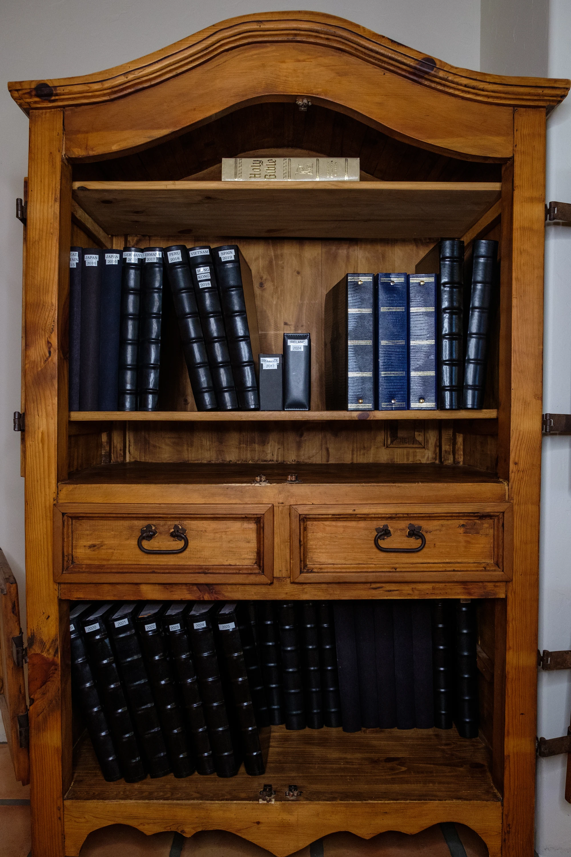 Organized armoire with photo albums